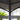 Close-up of a GrandPatio umbrella with text about steel frame stability.