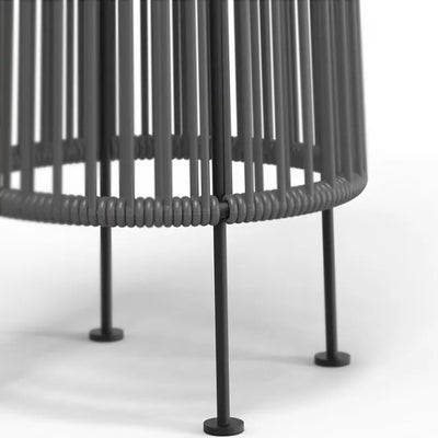 Close-up of a black metal chair with woven design on a white background