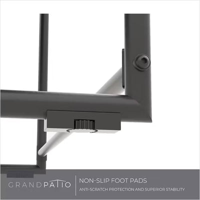 Close-up of a black metal stand with non-slip foot pads on a white background, featuring the Grand patio brand.