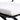 Close-up of a white cushion on a black metal frame