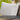 Gray cushion on a wicker chair with 'GrandPatio' branding and text about eco-friendly olefin fabric.
